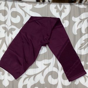 Fabletics workout leggings with mesh cutouts size 2 deep purple color